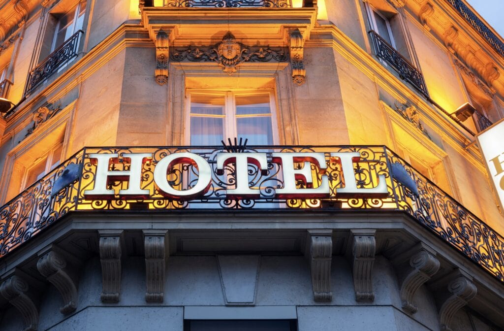 a hotel sign on the side of a building in Paris